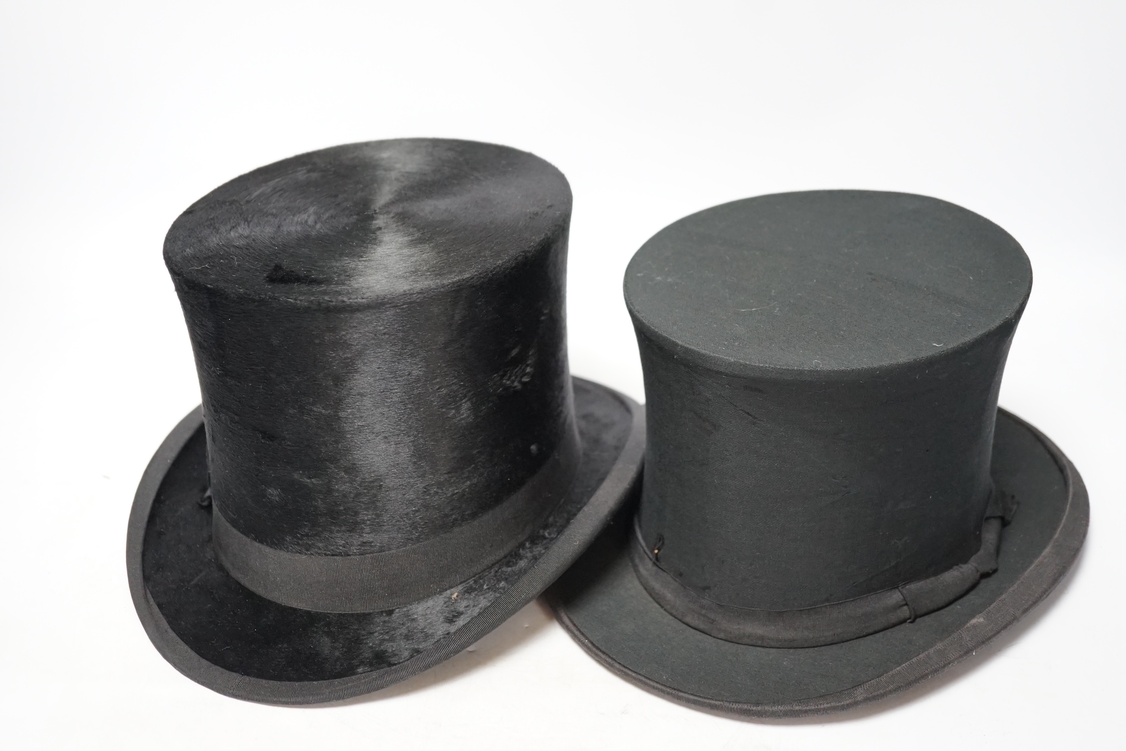 A brown leather top hat case together with a black silk collapsible top hat/opera hat and another, case 25cm high